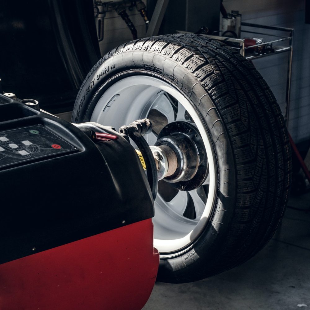 parts-of-broken-red-car-in-workshop.jpg